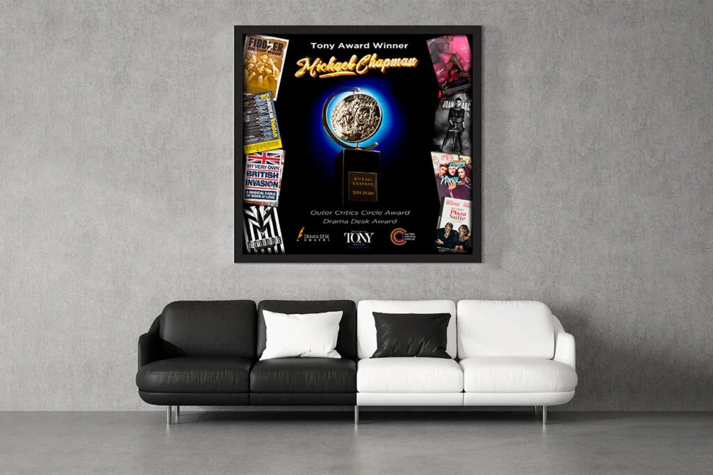 Michael Chapman award artwork displayed above a modern couch